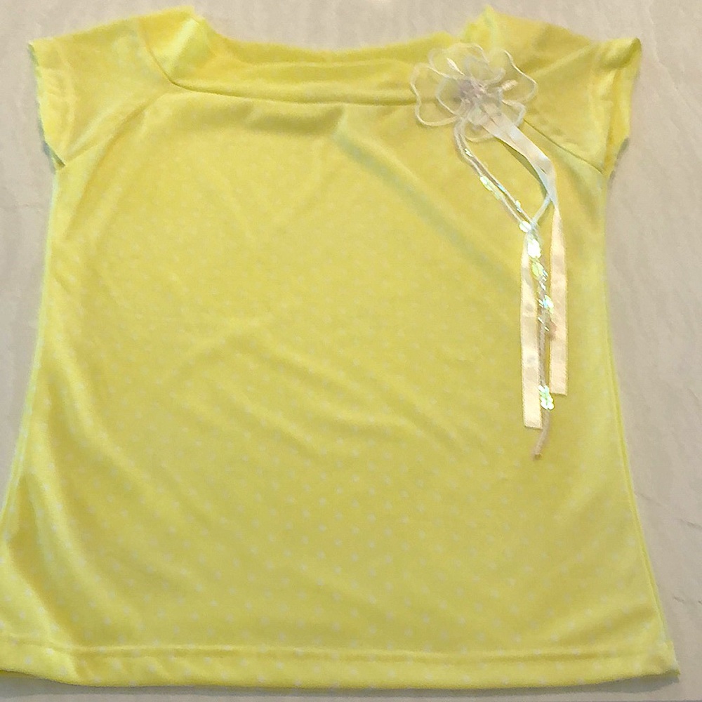 Yellow casual shirt with flower. Never worn and is in great condition.